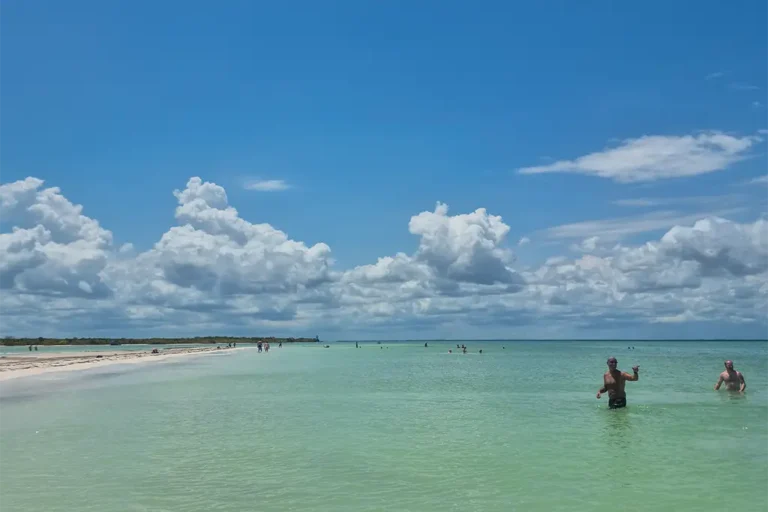 Visitors enjoying the shallow waters at Punta Cocos on Isla Holbox